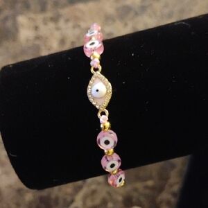 Chic Pink Evil Eye Bracelet with Gold Details